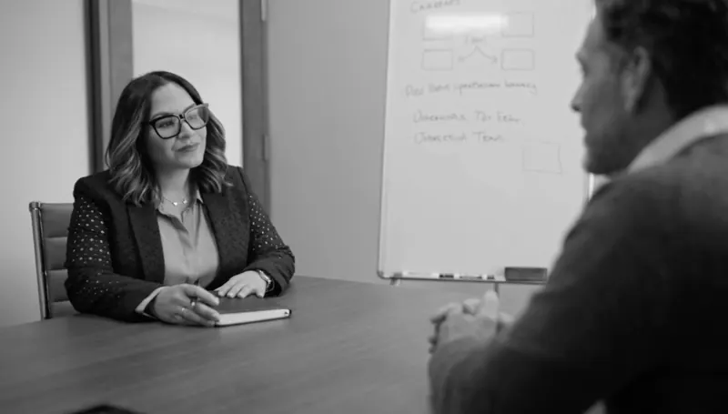 Maribel Rosario meeting with a client to plan a technology project